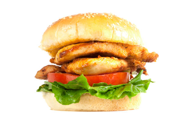 Juicy Chicken Burger A Juicy Chicken Burger with tomato and lettuce. Isolated on white. XXL file size available.  chicken breast photos stock pictures, royalty-free photos & images