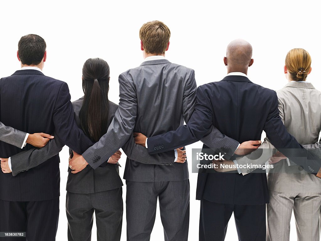 Vista posteriore di un Team di aziende in piedi insieme - Foto stock royalty-free di Relazione d'affari