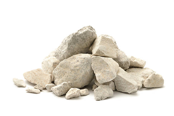 Limestone chippings Stone and dust (limestone) isolated on a white background. heap stock pictures, royalty-free photos & images