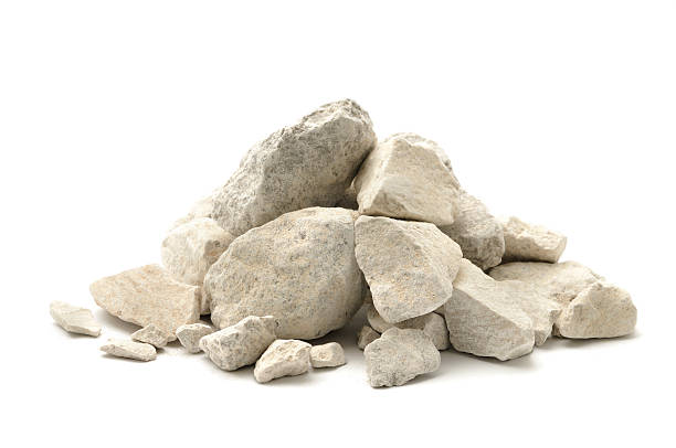 Limestone chippings Stone and dust (limestone) isolated on a white background. gravel mound stock pictures, royalty-free photos & images