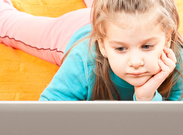 istock Little girl with laptop 183831075