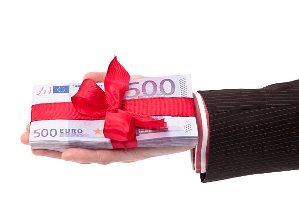 istock hand holding stack of 500 euro banknotes 183831609