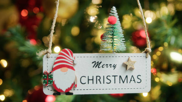 istock Merry Christmas patch Hanging from a Christmas tree 1838318167