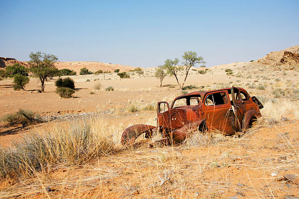 istock Abandoned car in the desert. 183832156