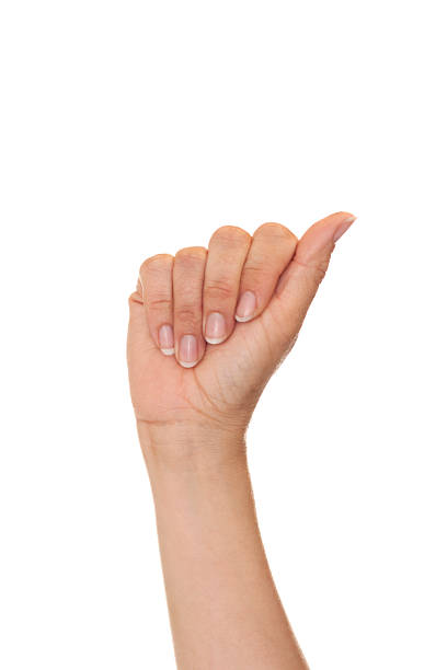 Caucasian female making the letter A using American Sign Language.