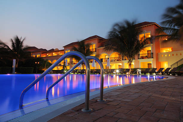 Tropical Hotel Pool at Sunset stock photo