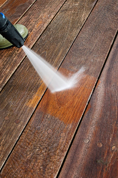 istock Cleaning Patio Decking With A Pressure Hose 183832814