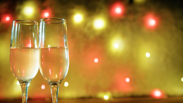 istock Sparkling wine glasses with disco lights in the background 1838331855