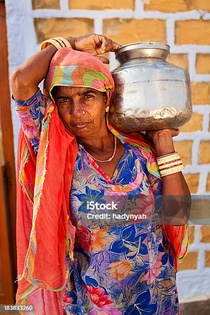 Indian Woman Carrying Water From Well Stock Photo - Download Image Now - Adult, Adults Only, Asia