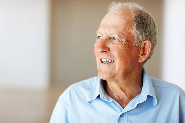 istock Senior man smiling and looking away 183833611