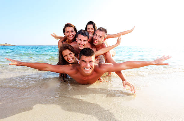 istock Pile of cheerful people on the beach. 183834352