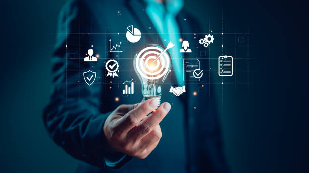 istock Businessman holding lightbulb with business goal and target icon, corporate development and global business leadership, success, strategy, prospects, sustainable goals. Ideas in business, inspiration 1838346363