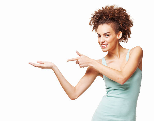 istock Woman Pointing at an Empty Hand - Isolated 183834666
