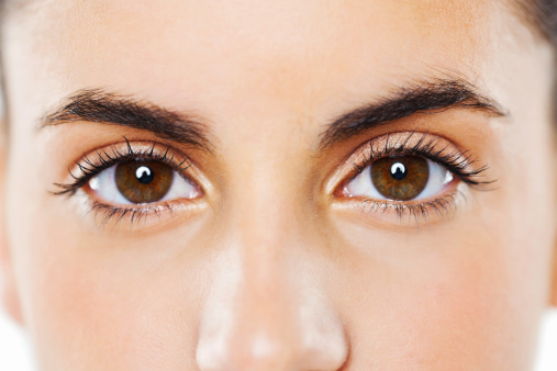 Closeup and cropped image of a young woman's eyes. Horizontal shot.