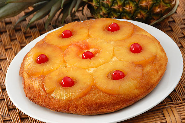 istock Close-up of pineapple upside down cake on white plate 183835219