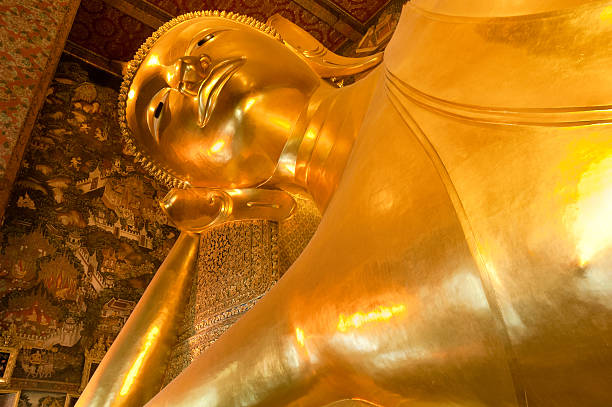 istock Golden Reclining Buddha In Thailand 183835460