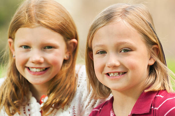 istock Portrait of Two happy smiling Sisters 183835495