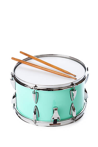 Green Snare Drum with Drumsticks, Instrument Isolated on White Background Subject: A green drum with drum sticks isolated on a white background. snare drum photos stock pictures, royalty-free photos & images