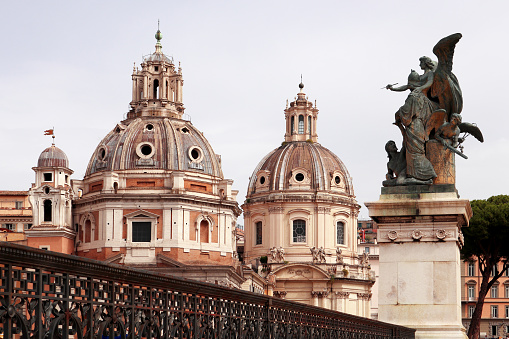 View of the Church of Santa Maria di Loreto, on the left and behind, almost identical, the Church of the Most Holy Name of Mary at the Roman Forum