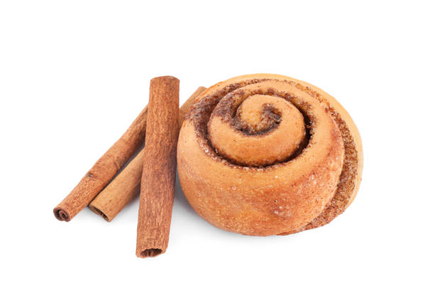 istock One tasty cinnamon roll and sticks isolated on white 1838363750
