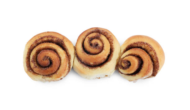 istock Tasty fresh cinnamon rolls isolated on white, top view 1838364016