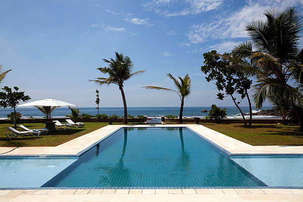 istock luxury villa swimming pool 183836416