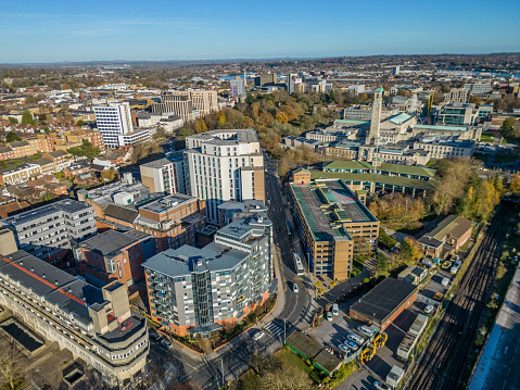 Southampton city center with modern apartments office buildings next to central railway station. High altitude aerial view.