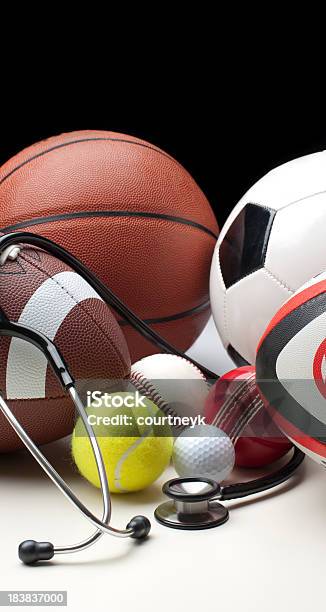 Different Sports Balls With Stethoscope Stock Photo - Download Image Now - Soccer, American Football - Ball, American Football - Sport