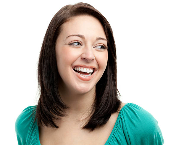 Happy Laughing Young Woman Looking Sideways Portrait of a woman on a white background. http://s3.amazonaws.com/drbimages/m/marbra.jpg sideways glance stock pictures, royalty-free photos & images