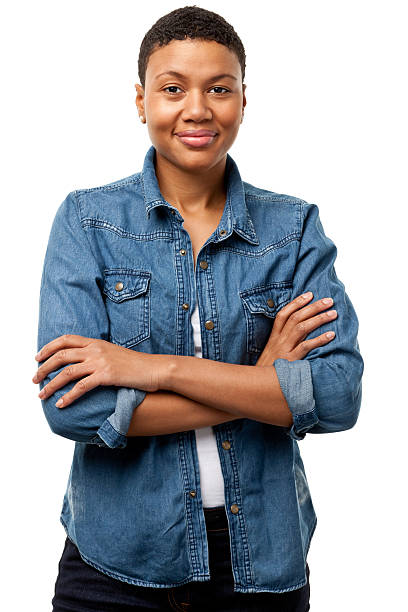 Content Young Woman With Arms Crossed Portrait of a young woman on a white background. http://s3.amazonaws.com/drbimages/m/pripri.jpg denim jacket stock pictures, royalty-free photos & images