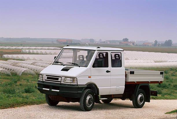 istock White open box truck parked near the fields 183837228
