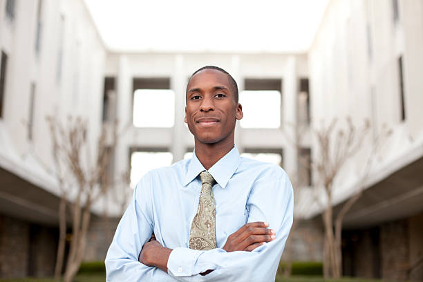 istock Confident businessman with building in the background 183837372