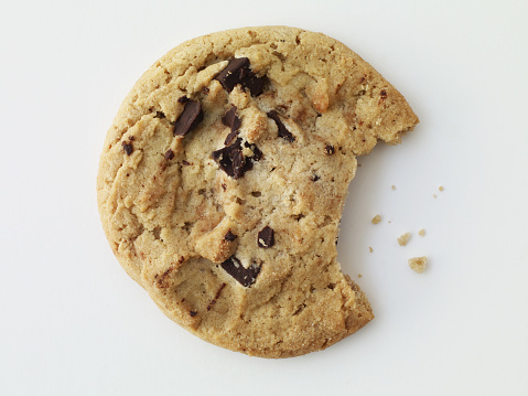 Chocolate chip cookie with a bite taken out-clipping path included