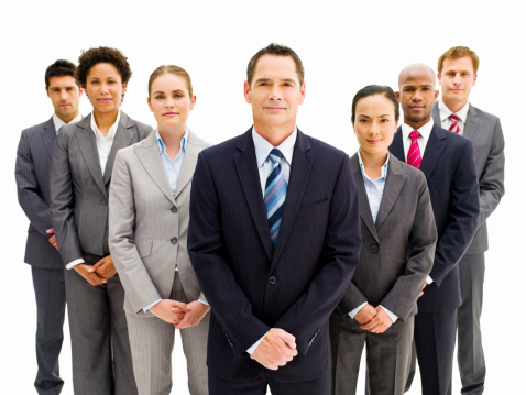 Team of confident business people standing together in a V formation. Horizontal shot. Isolated on white.