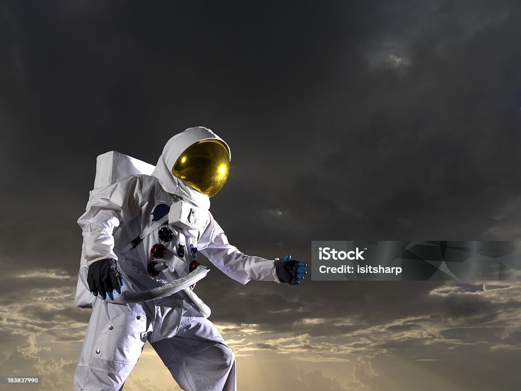 Astronaut "Astronaut, dark, moody lunar skySee more like this:" Astronaut Stock Photo