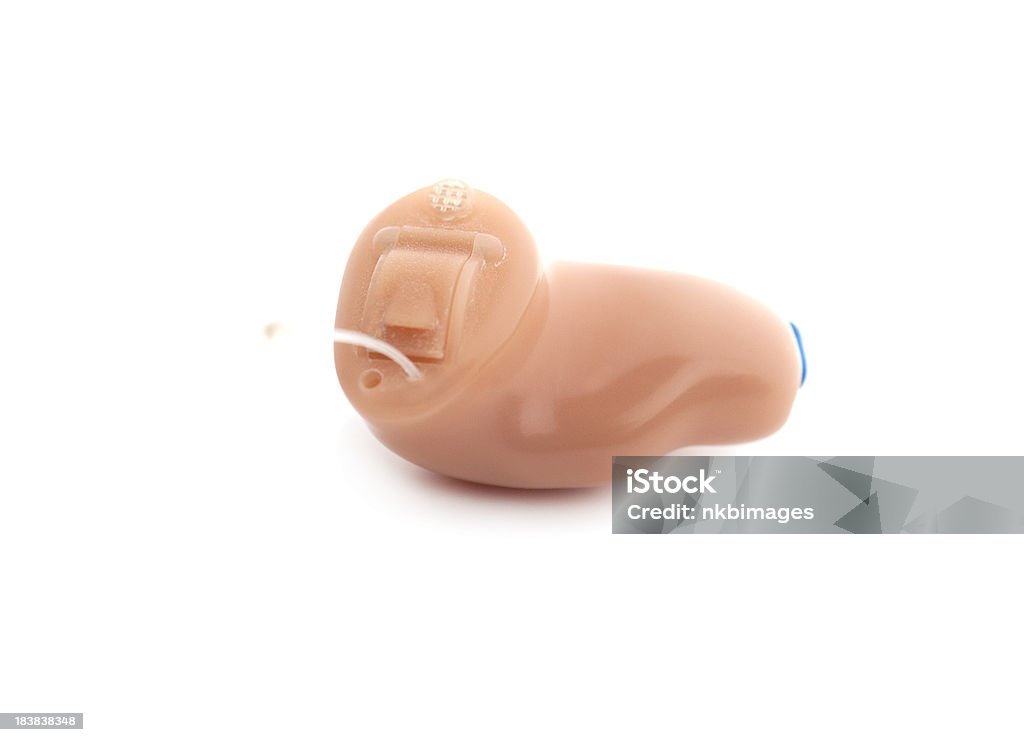 Digitally programmable CIC (completely in canal) hearing aid Programmable CIC(completely in the canal) hearing aid on white background. Hearing Aid Stock Photo