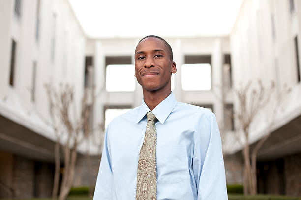 istock Confident businessman with building in the background 183838565