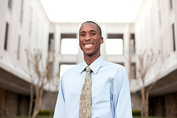 istock Confident businessman with building in the background 183838571