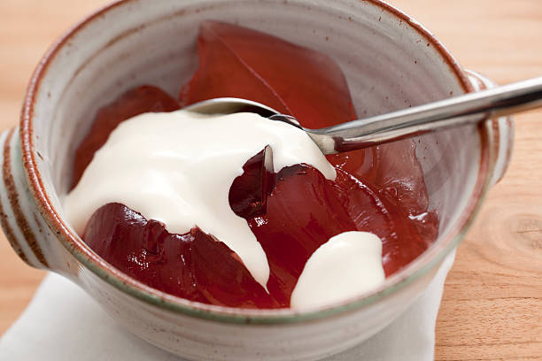 istock Bowl of red jelly with cream 183839088