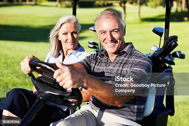 Smiling Couple In A Golf Cart Stock Photo - Download Image Now - Golf, Summer, 50-59 Years
