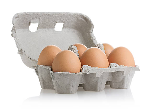 Eggs (Clipping Path) Six eggs in carton isolated on white with clipping path. egg carton stock pictures, royalty-free photos & images