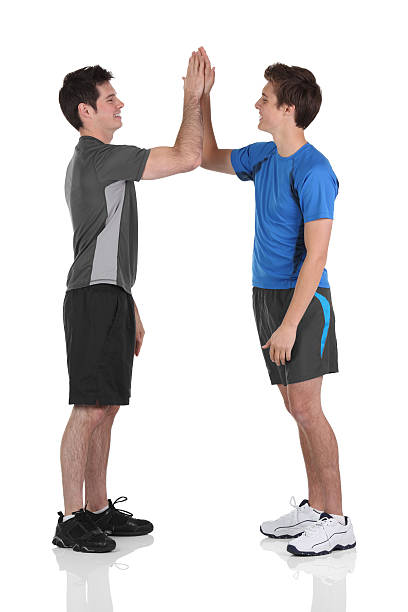 istock Friends giving high five to each other 183840095