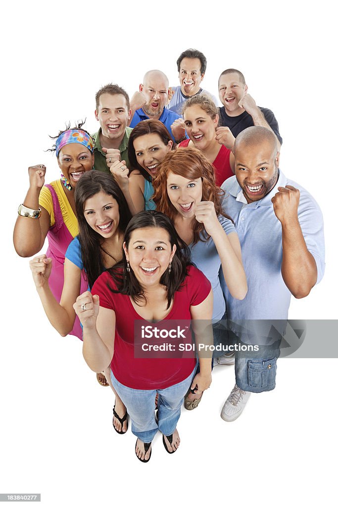 Diverso grupo de adultos sonriente mirando hacia arriba con planteado Fists - Foto de stock de 30-39 años libre de derechos