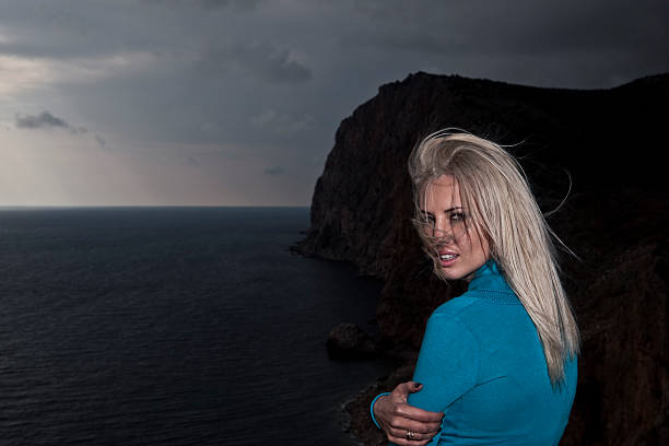 young blonde woman posing in nature, sewastopol, ukraine.