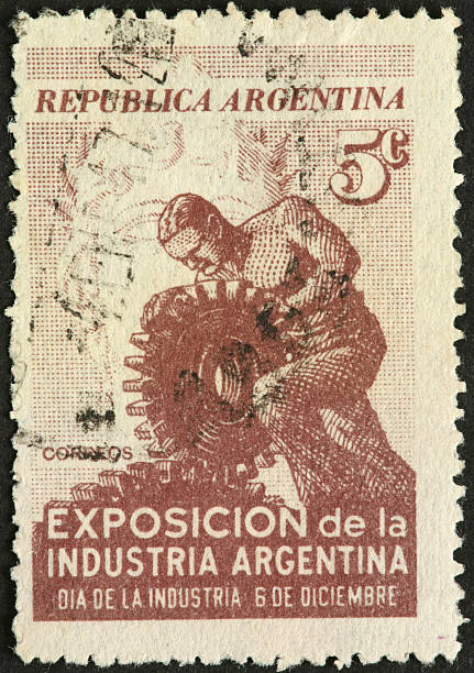istock laboring man with large mechanical gears on an Argentina stamp 183840560