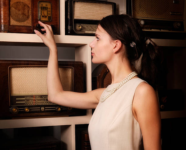 istock Retro woman turning dial on radio 183840833