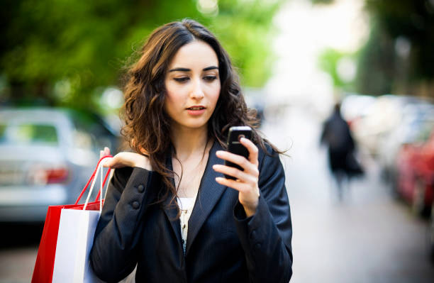 istock Selective focus young woman shopping and texting 183841067