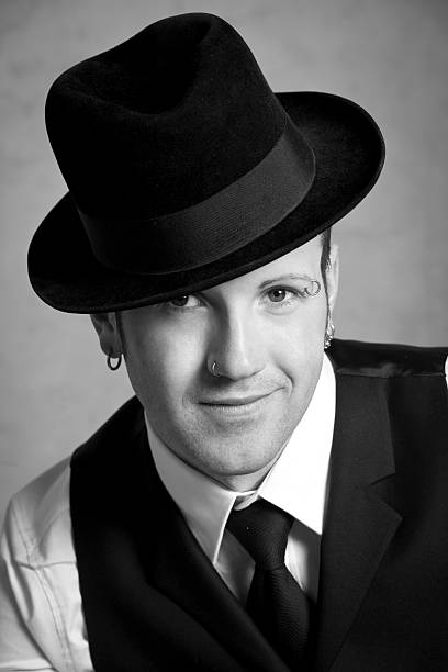 istock Portrait of a young well-dressed man with hat 183841345