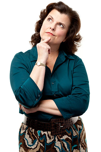 Woman thinking and looking up with finger on chin