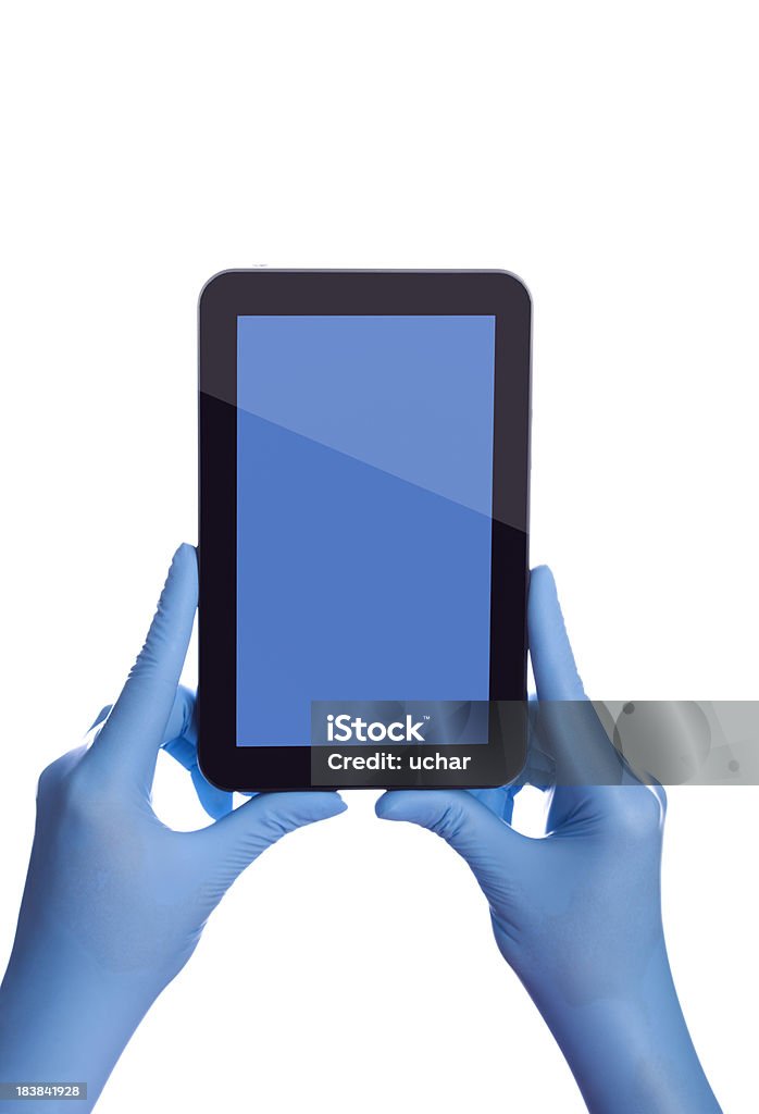 Trzymając Tablet z ekranem dotykowym - Zbiór zdjęć royalty-free (Niebieski)